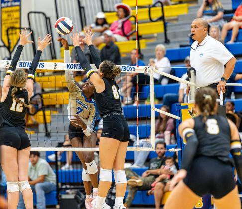 Junior Jordin Southall, shown in an earlier-season match, delivers five aces served in set three against Harmony. The Kowboys (12-3) won in straight sets Tuesday night to remain perfect against county opposition. PHOTO/DAN PEARSON