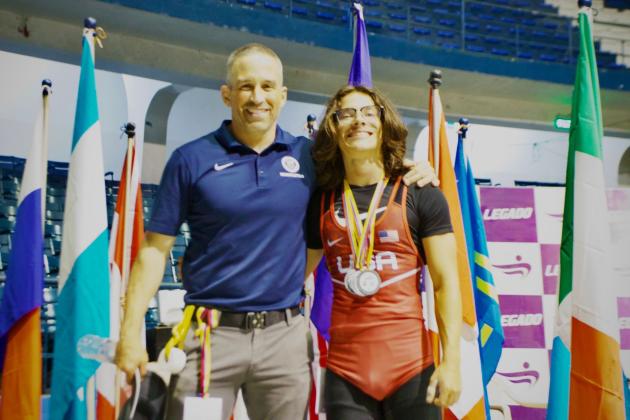 Flanked by his coach Cory Aun, St. Cloud senior Mikey Ziss displays the silver medals he won at the Pan American Under 17 Youth Championships.  (Photo courtesy Ziss family).