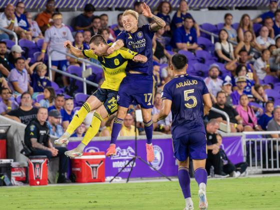 Dag­ur Dan Þór­halls­son, part of Orlando City's young core, fights for a header in Saturyday's 3-0 home win against Nashville SC. PHOTO/MARIO CASAMALHUAPA
