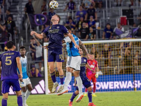 Duncan McGuire wins a header. PHOTO/MARIO CASAMALHUAPA