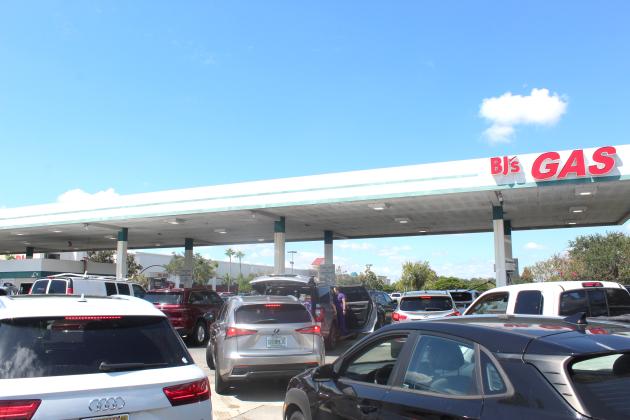 Cars gas up ahead of Hurricane Helene on Sept. 23 at the BJs Wholesale in Kissimmee. This scene is playing out in a number of places in Florida as residents evacuate to avoid Hurricane Milton's storm surge and winds. FILE PHOTO