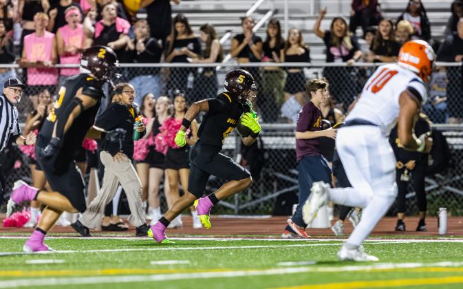 St. Cloud's Bryce Williams returns an interception for a touchdown in the second half -- it proved to be the winning margin in the 31-24 win.  PHOTO/TAYLOR MCFEE