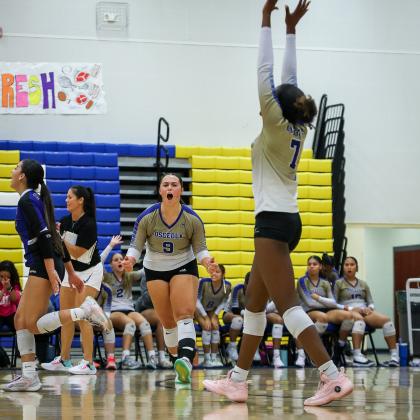 Movin' On: the Kowboys' Cate Palmi (9) and Jordin Southall (7) celebrate a point and the victory Wednesday. The Kowboys play Saturday in the Region 7A-2 semifinals. PHOTO/TAYLOR MCFEE