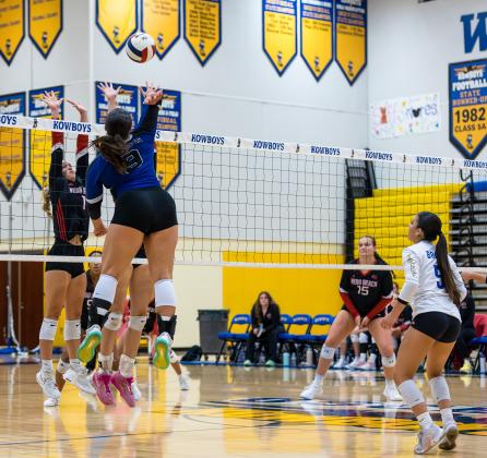 Cate Palmi hammers down one of her match-leading 18 kills in Wednesday's regional final victory. PHOTO/TAYLOR MCFEE