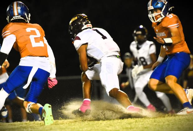 St. Cloud's T.J. Griffin, who rushed for 141 yards Friday, urges the defense to "eat his dust". PHOTO/KATIE WILLIAMS