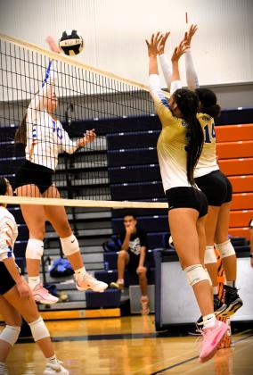 Harmony's Allyson Godwin goes up for a hit against Osceola Thursday. PHOTO/KATIE WILLIAMS