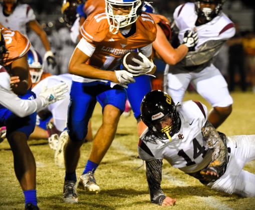 Ivan Rmaos, shown here running the ball, scored Harmony's lone touchdown. PHOTO/KATIE WILLIAMS