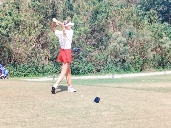 St. Cloud's Karolyna Adams prepares to tee off in Monday's OBC championship. PHOTO/J. DANIEL PEARSON