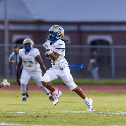Osceola's Alijah Jenkins returned the opening kickoff 95 yards for a touchdown Tuesday, igniting the Kowboys' 49-9 win over Viera. PHOTO/TAYLOR MCFEE