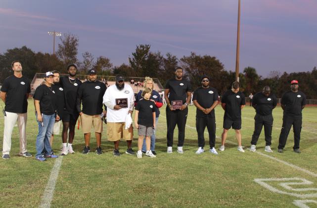 Poinciana and Gateway coaches and officials honored Jeff Mathis, a former coach for both teams, who passed away earlier this year. PHOTO/KEN JACKSON