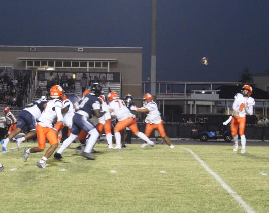 Tohopekaliga's Sabby Meassick passes to Tony Brown early in Friday's game against Lake Nona. PHOTO/KEN JACKSON