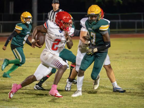 Will Nezius carries the ball for Poinciana Friday. PHOTO/MARIO CASAMALHUAPA