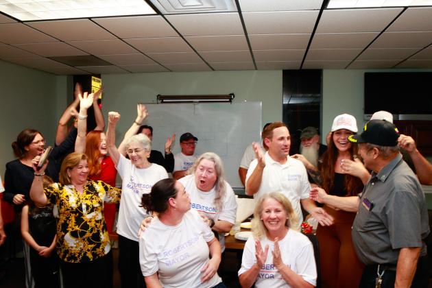 The moment of victory — Chris Robertson celebrates with his supporters Tuesday night when it became official he will be St. Cloud's new mayor. PHOTO/TAYLOR MCFEE