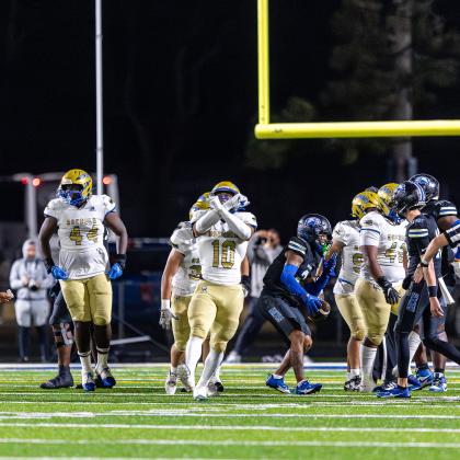 "None shall pass": Osceola linebacker Elijah Melendez reacts to the Osceola defense's fourth-down stop, preserving a scoreless tie at halftime Friday against Armwood. PHOTO/TAYLOR MCFEE