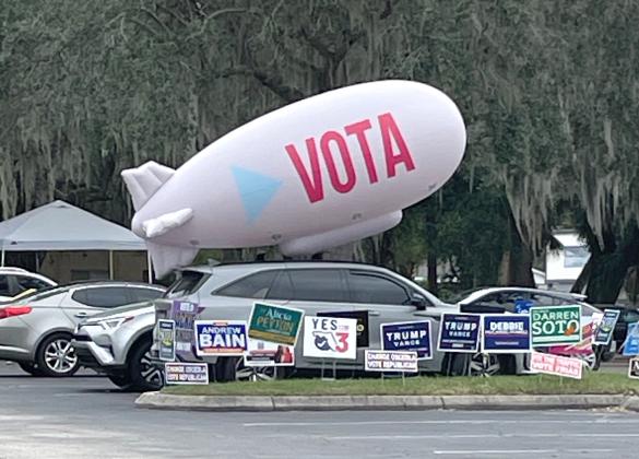 Candidates went to great lengths to get voters' attention with signs, and other visuals, at polling places like Kissimmee Civic Center. PHOTO/TONI ROWAN