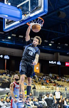 Jalen Slawson throws down a dunk Thursday in the Osceola Magic's 116-110 loss to the Rio Grand Vipers. PHOTO/TAYLOR MCFEE