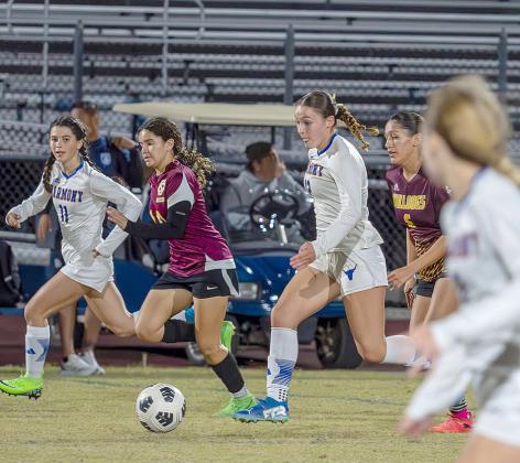 Harmony’s Jadyn Frost (11 in white) and Jada Bloodworth (12) and St. Cloud’s Yamaris Abreu (10) and Meaghan Cannata (6) track down the ball in Friday’s OBC championship game. PHOTO/MARIO CASAMALHUAPA