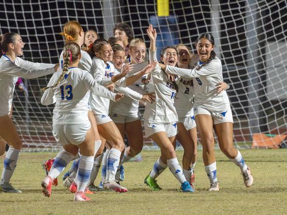 Harmony celebrates its game-clinching goal. PHOTO/MARIO CASAMALHUAPA