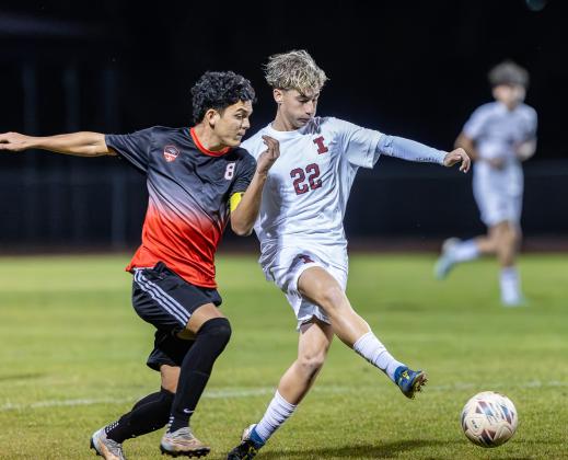 Gateway's Luis Rivero and Innovation's Diego Catania fight for a ball in Tuesday's district championship. PHOTO/TAYLOR MCFEE