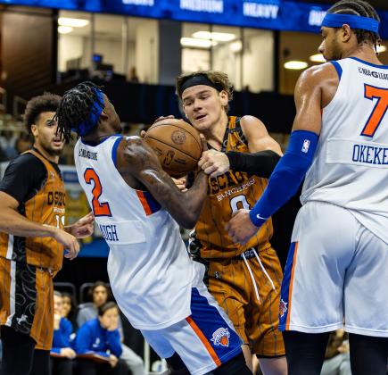 Osceola's Mac McClung fights for a loose ball with Westchester's Damion Baugh. PHOTO/TAYLOR MCFEE