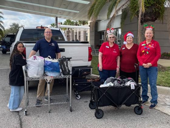From left: Destiny Ortiz, VA Volunteer; Benjamin Lopez, VA CDCE Specialist; Nona Osha, Joshua Stevens Chapter, NSDAR Librarian/Historian; Kim Tennison, Joshua Stevens Chapter, NSDAR Chapter Regent; Lisa Heard, Joshua Stevens Chapter Chair will a donation of needed items to the Orlando VA Medical Center-Lake Nona Domicile for female veterans. SUBMITTED PHOTO