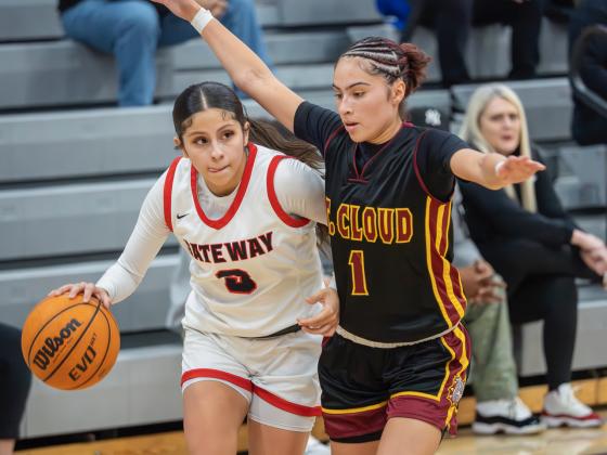 St. Cloud point guard Arianna Rivera sticks close to her counterpart Alyssa Marino from Gateway in Friday's OBC championship game. PHOTO/MARIO CASAMALHUAPA