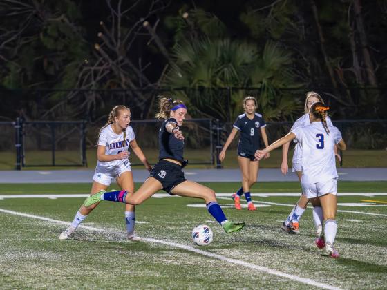 Celebration's Ellie Armstrong loads up to fire a pass downfield in Tuesday's District 7A-7 championship game. PHOTO/MARIO CASAMALHUAPA