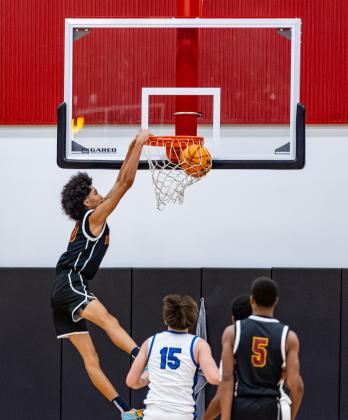 St. Cloud's Malaki Baker throws down a dunk. PHOTO/TAYLOR MCFEE