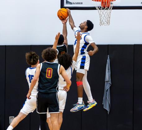 Osceola's Jordan Mundle blocks a St. Cloud shot. PHOTO/TAYLOR MCFEE