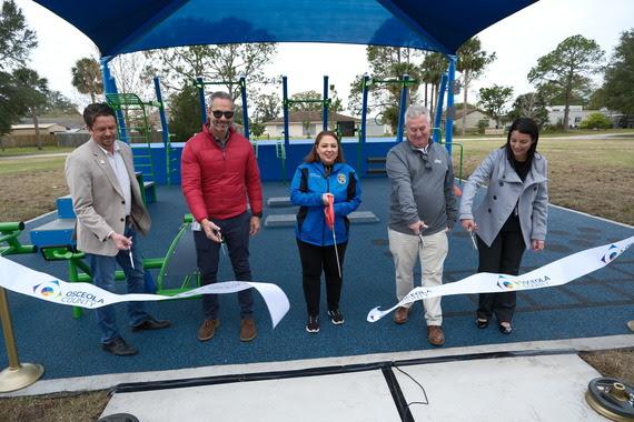 Osceola County officials cut the ribbon Wednesday on a new public fitness pad – the first of its kind in the county – at 65th Infantry Park in Buenaventura Lakes. PHOTO/OSCEOLA COUNTY