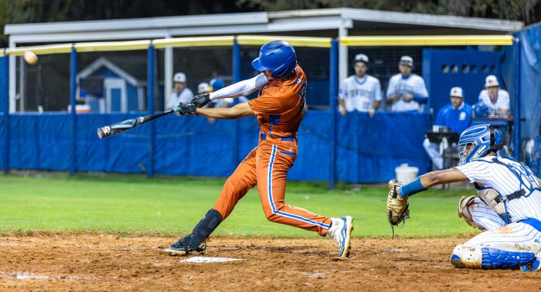 Harmony third baseman Angel Medina, shown here in the Longhorns' win at Osceola Feb. 25, scored two runs and drove in another Friday against the Kowboys. PHOTO/TAYLOR MCFEE