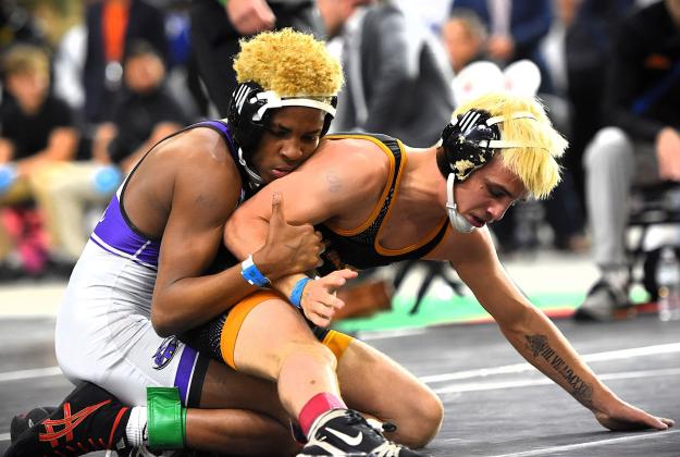 Harmony's Tristan Horn battled, but could not overcome, Southwest Miami's Lazaro Soto for the 106-pound Class 3A championship. His efforts did help the Longhorns to a seventh place in the 3A team competition. PHOTO/KATIE WILLIAMS