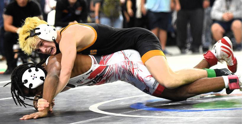Harmony's Nathan Lyttle outlasted Lake Mary's Damonyai White, 2-1, to win the FHSAA Class 3A 113-pound state wrestling championship Friday at the Silver Spurs Arena. PHOTO/KATIE WILLIAMS