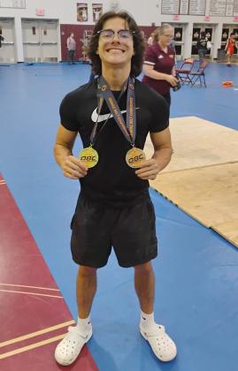 St. Cloud’s Mikey Ziss displays his two gold medals from the OBC Championships. Ziss, a senior, won two state championships last year and hopes to duplicate that in 2025. PHOTO/J. DANIEL PEARSON