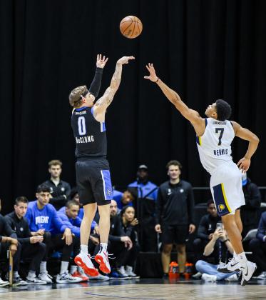 Mac McClung fires a shot over Indiana's RayJ Dennis in the Osceola Magic's 129-114 playoff win Thursday. PHOTO/TAYLOR MCFEE