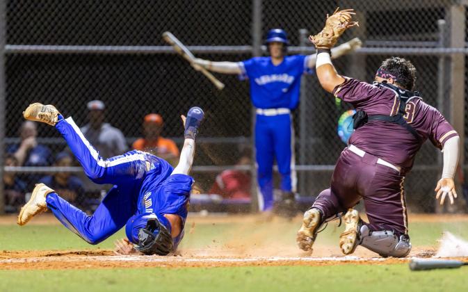 It was a wild, rough-and-tumble night for baseball at Tohopekaliga High Friday, where Harmony (in blue) topped St. Cloud, 7-6 in the Orange Belt Conference championship game. PHOTO/TAYLOR MCFEE