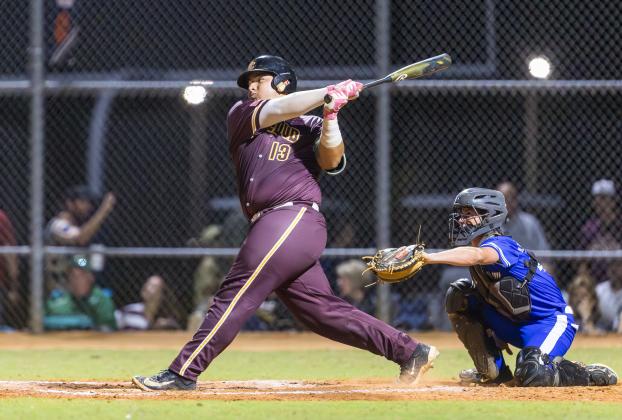 St. Cloud catcher Sammy Echeverry takes a big cut at a pitch in Friday's OBC championship game against Harmony. PHOTO/TAYLOR MCFEE