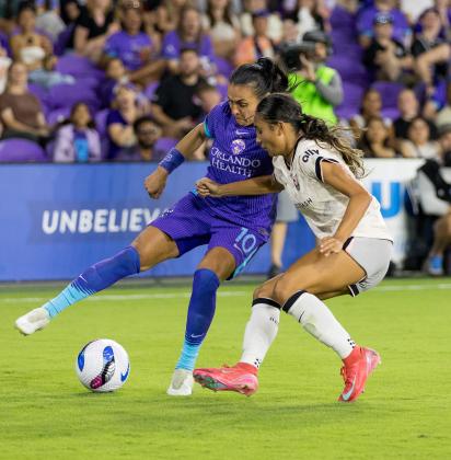 The Orlando Pride's Marta fights for the ball against an Angel City defender Friday. (Photo/Taylor McFee)