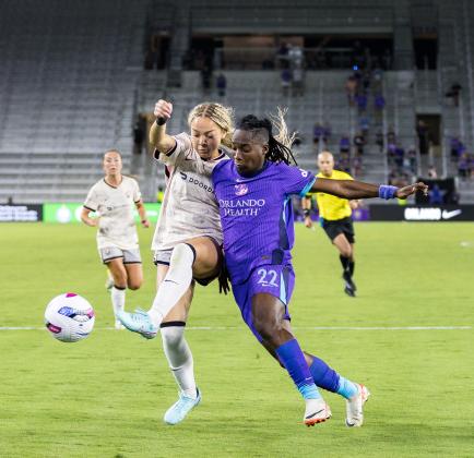 The Orlando Pride's Barbara Banda fights for the ball against an Angel City defender Friday. (Photo/Taylor McFee)