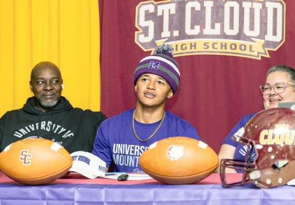 St. Cloud’s T.J. Griffin and Espn Pool, with family, coaches and teammates, signed college scholarships last week.
