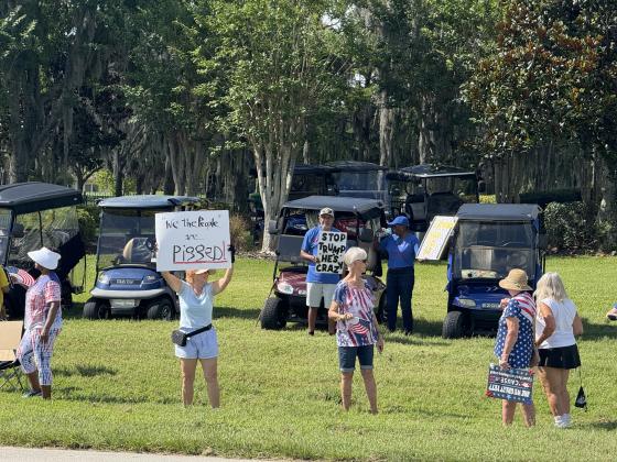 As part of the nationwide "No Kings" day of defiance, a protest was held Saturday morning outside of the gates of Solivita along Cypress Parkway in Poinciana. (Photo/Lisa Concepcion)