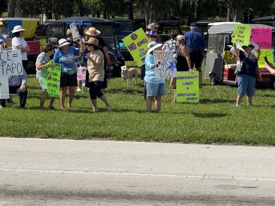 As part of the nationwide "No Kings" day of defiance, a protest was held Saturday morning outside of the gates of Solivita along Cypress Parkway in Poinciana. (Photo/Lisa Concepcion)