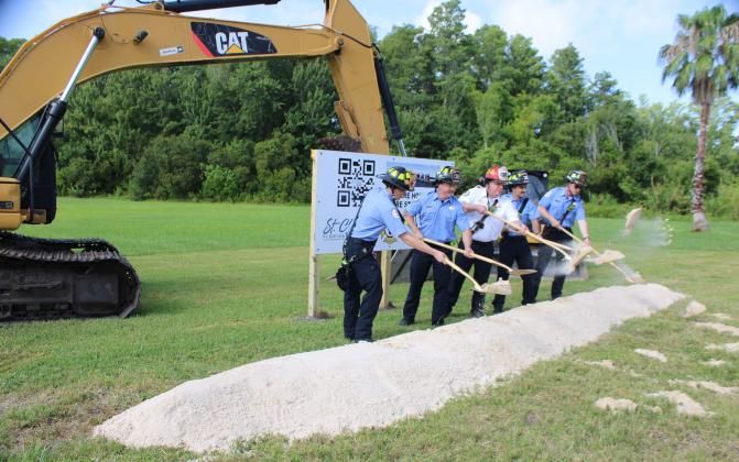 Current and future Station 32 staff participate in the groundbreaking for the newest fire department facility Friday. (Photo/Terry Lloyd)
