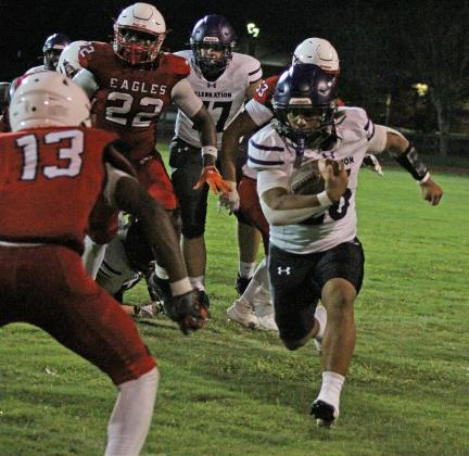 The Storm's Jayden Rodriguez (26) takes on Eagle defenders on Friday nightat Poinciana High School.