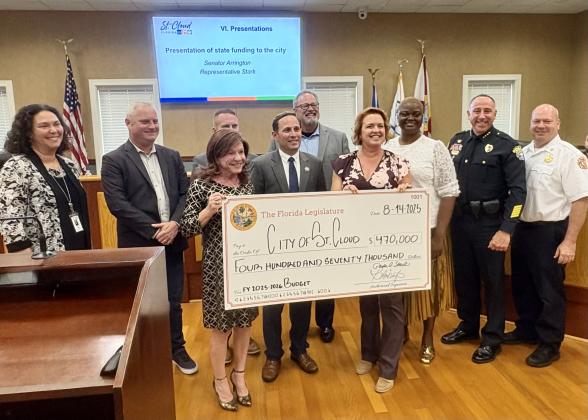 State Rep. Paula Stark and Sen. Kristen Arrington presented $470,000 in state funding to purchase a flooding dam system and a new St. Cloud Fire boat at Thursday’s St. Cloud City Council meeting. (Photo/Debbie Daniel)