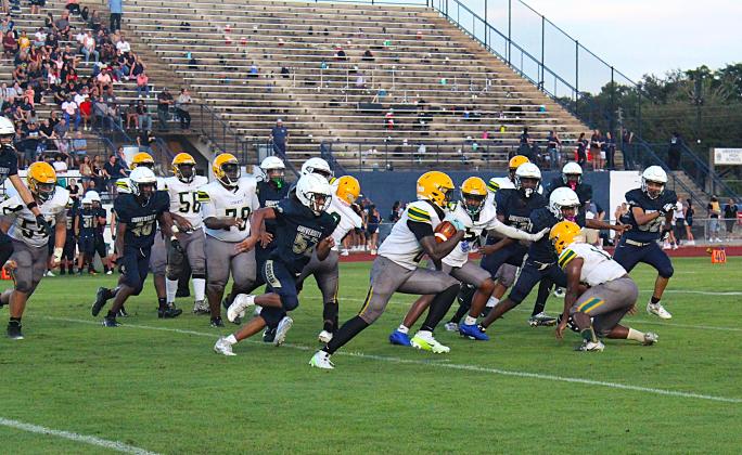 Liberty Rashad Robinson runs around the right end in the Chargers' Kickoff Classic Friday. (Photo/Ken Jackson)