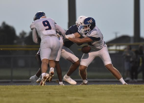 Deee-fense! Harmony's Colton Sklarek (9) sacks Poinciana quarterback Kamari Lewis and forces a fumble that Brody Malukiewicz recovers, setting up another touchdown. (Photo/Katie Williams)