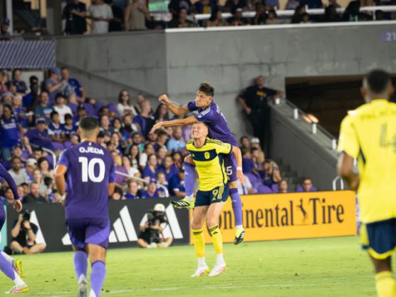 Rodrigo Schlegel contains MLS leading scorer Sam Surridge. Photo by Mario Casamalhuapa