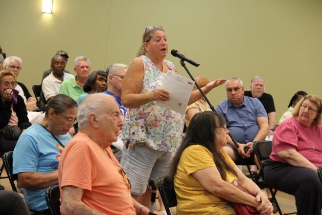 Resident Kathleen Burns speaks to the CFX committee about the Southport Connector Expressway project in Poinciana Thursday. (Photo/Michelle Kostuch)