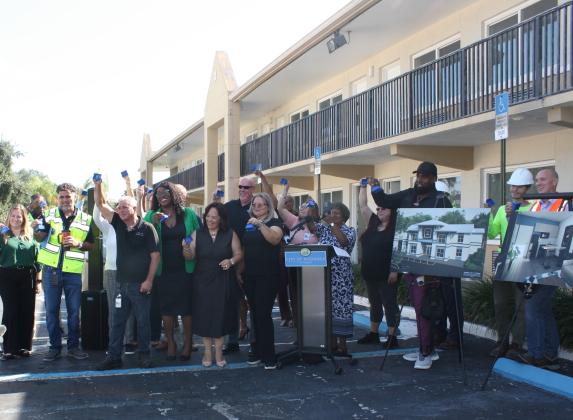 Kissimmee city officials and construction representatives "rang the bell" Thursday at Haven on Vine.  (Photo/Christine Pike)